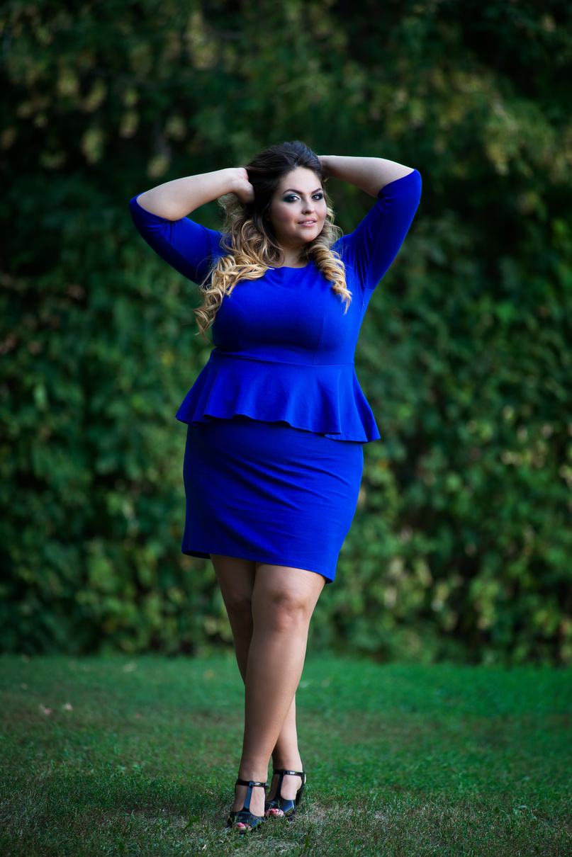 Young plus size fashion model outdoors, xxl woman on nature